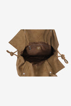 Isabelle Bag in Earth — open, viewed from above, on light grey