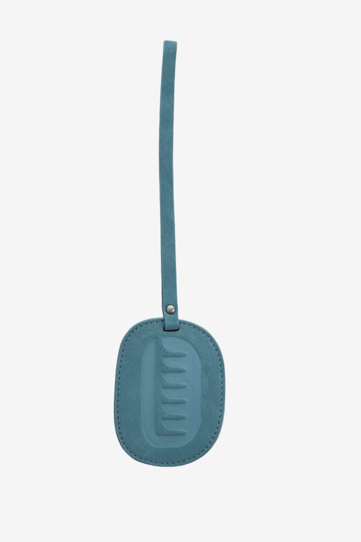 Isabelle Bag in Sky — bag charm, back, on light grey