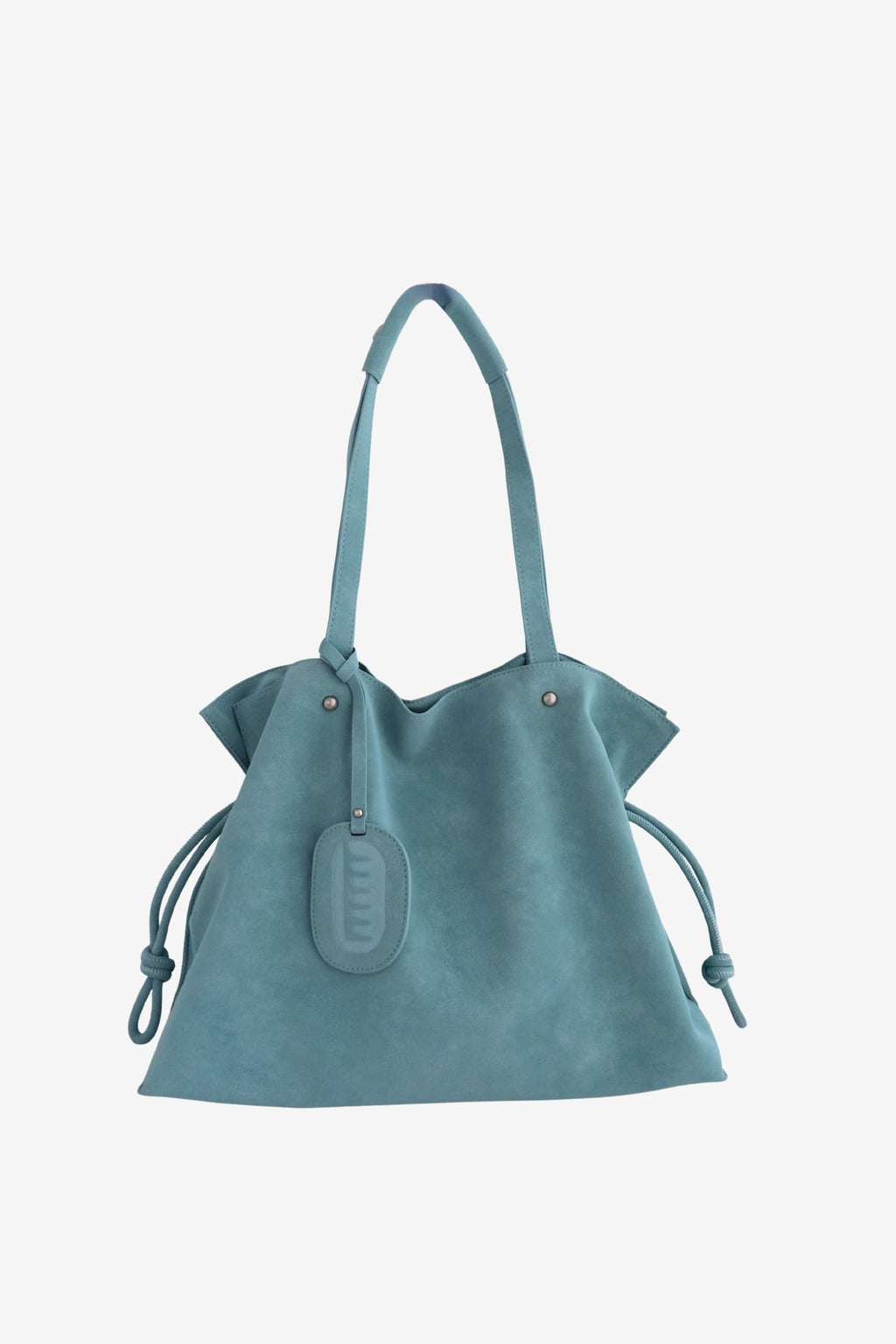 Isabelle Bag in Sky — front view with the bag charm, on light grey