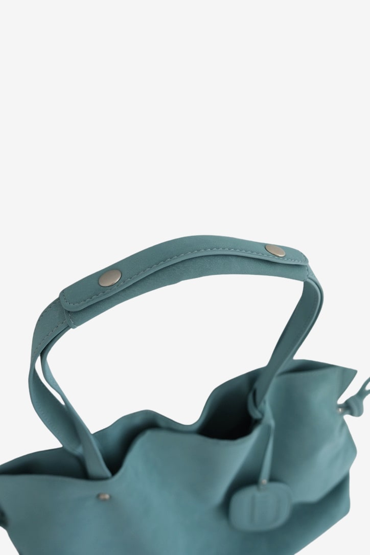 Isabelle Bag in Sky — shoulder strap detail, on light grey